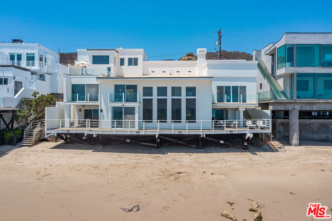 24314 Malibu Road Malibu, CA 90265 - Photo 2 of 41 a front view of a building with a yard