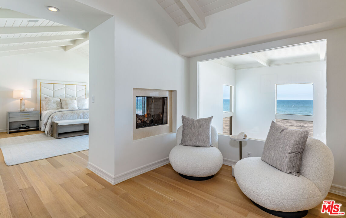 24314 Malibu Road Malibu, CA 90265 - Photo 23 of 41 a living room with furniture and a wooden floor