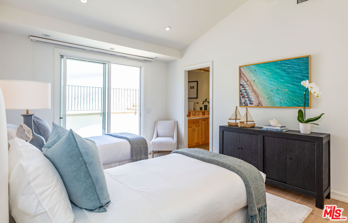 24314 Malibu Road Malibu, CA 90265 - Photo 34 of 41 a bedroom with two beds and large window