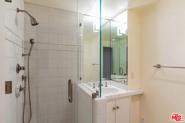a bathroom with a sink and mirror