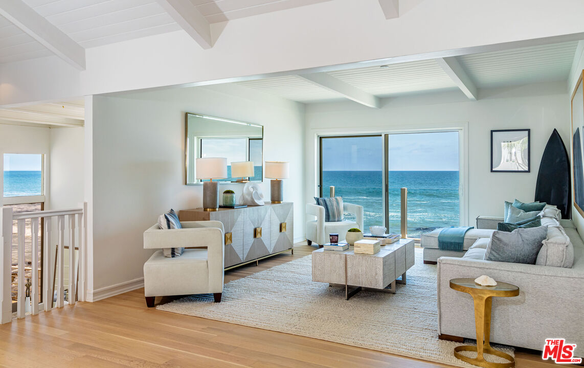 24314 Malibu Road Malibu, CA 90265 - Photo 6 of 41 a living room with furniture and a large window