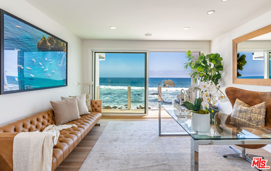 24314 Malibu Road Malibu, CA 90265 - Photo 7 of 41 a living room with furniture flowerpot and wooden floor