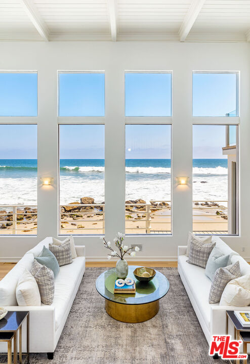 24314 Malibu Road Malibu, CA 90265 - Photo 8 of 41 a living room with furniture and a large window