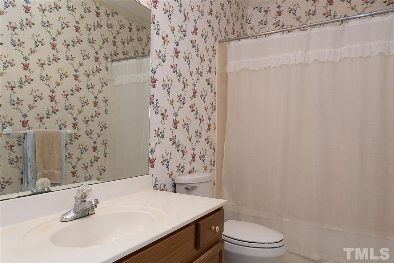 4412 Hopson Drive Raleigh, NC 27604 - Photo 14 of 25 a bathroom with a sink toilet and shower