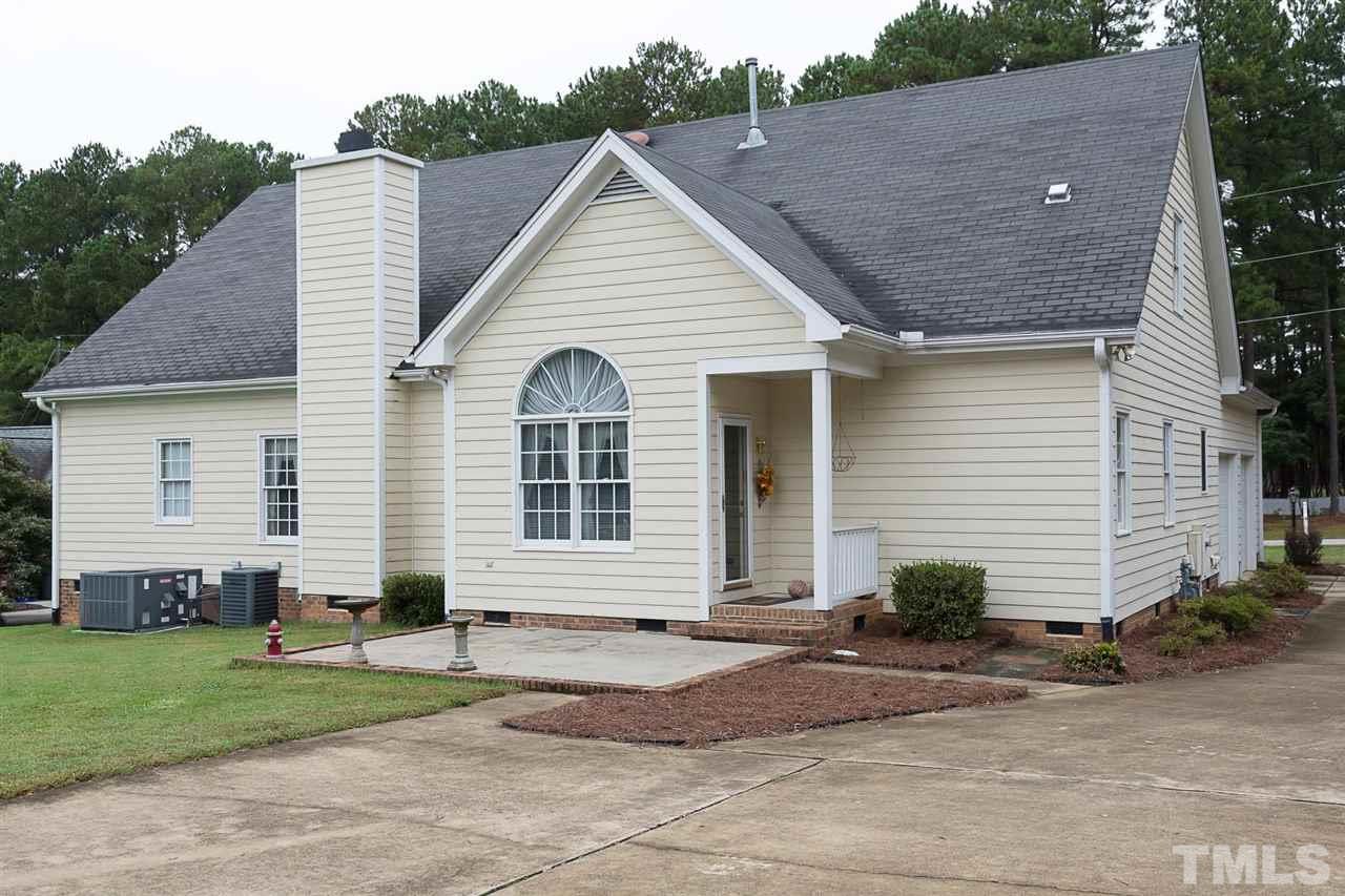 4412 Hopson Drive Raleigh, NC 27604 - Photo 22 of 25 a view of a house with a yard
