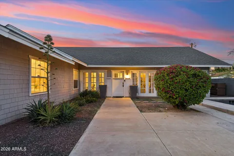 a front view of a house with garden