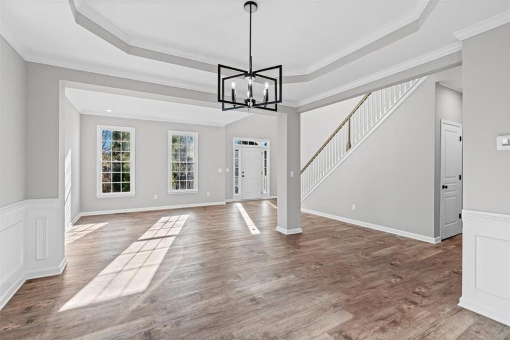 1038 Middlebrooke Drive Canton, GA 30115 - Photo 24 of 76 a view of an empty room with wooden floor and windows