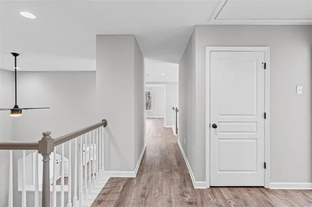 a spacious bathroom with a tub sink and mirror