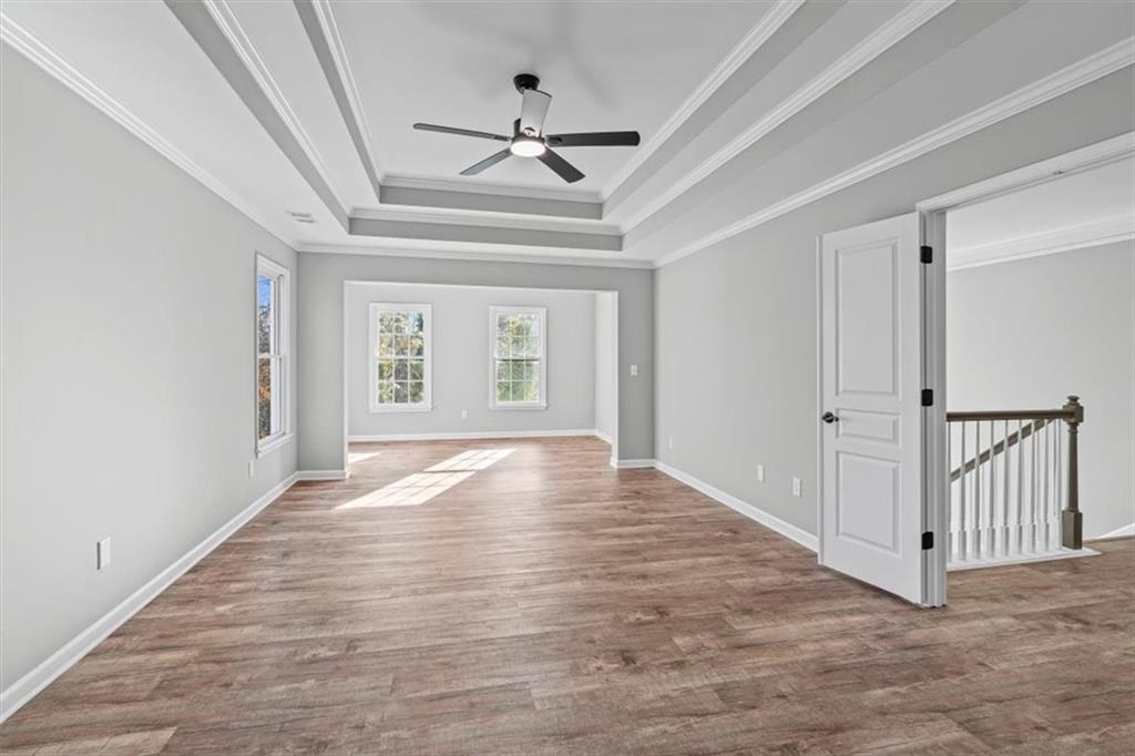 1038 Middlebrooke Drive Canton, GA 30115 - Photo 28 of 76 wooden floor in an empty room with a window