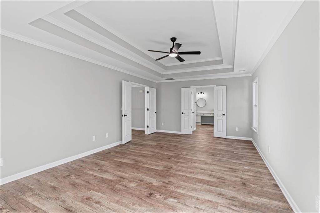 1038 Middlebrooke Drive Canton, GA 30115 - Photo 29 of 76 a view of empty room with wooden floor and ceiling fan