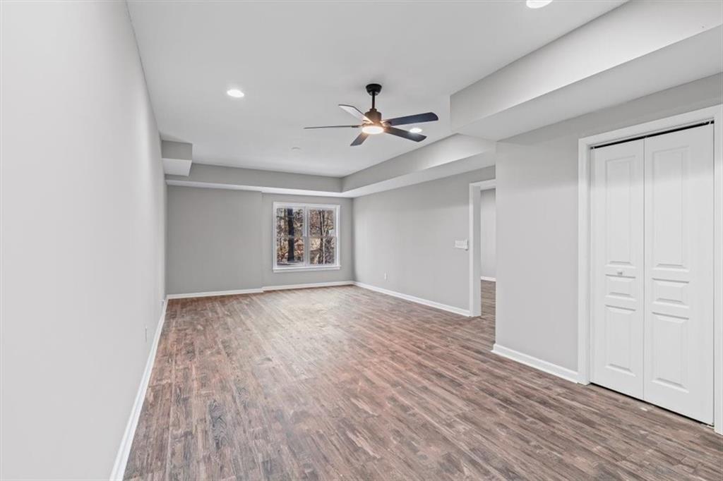 1038 Middlebrooke Drive Canton, GA 30115 - Photo 40 of 76 wooden floor in an empty room with a window