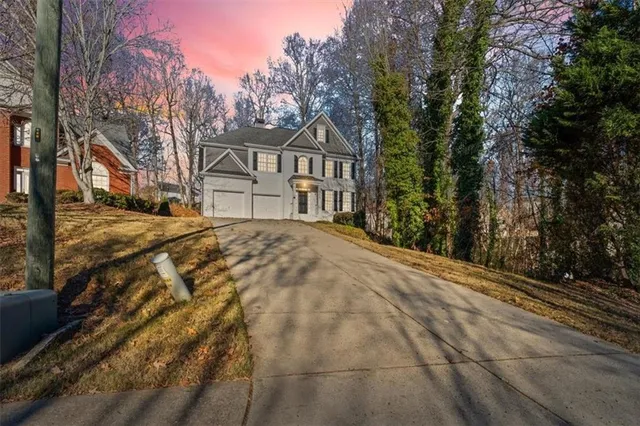 a view of a house with a large trees