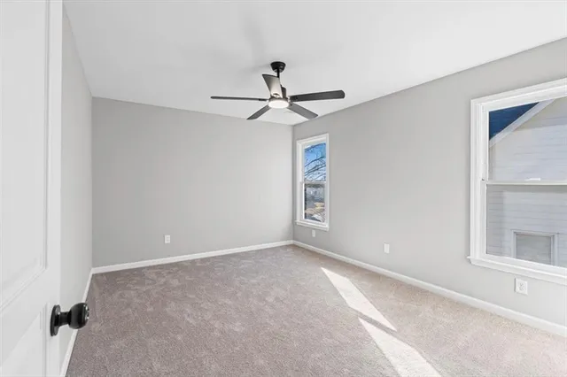 a view of dirt yard with a large tree