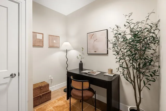 a view of a workspace with furniture