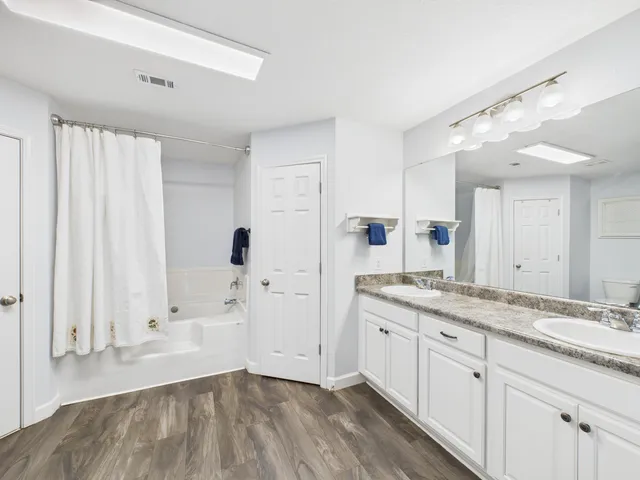 a view of a bathroom with a sink and mirror