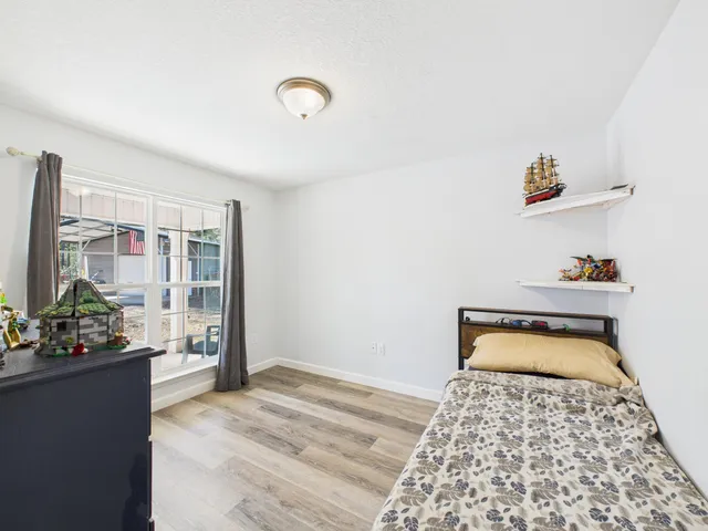 a bed room with a bed and a dresser