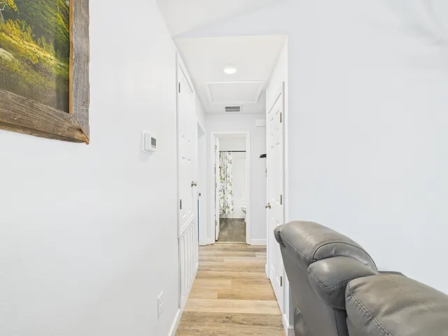 a view of room with window and hardwood floor