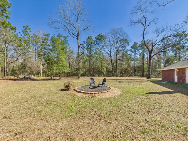 a backyard of a house with a trees