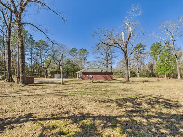 a backyard of a house with lots of green space