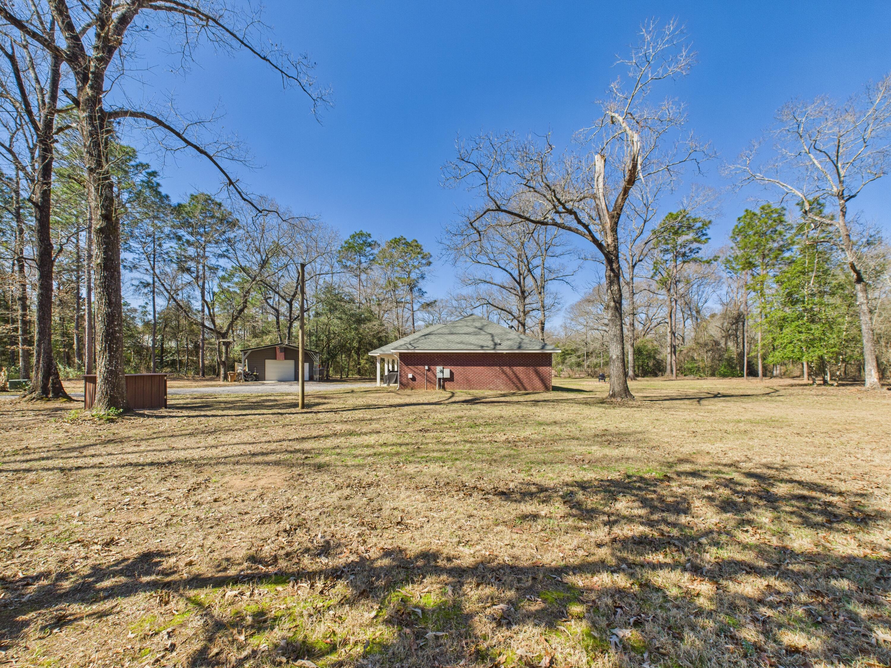 9866 Red Rock Road Milton, FL 32570 - Photo 39 of 44 Side Yard View
