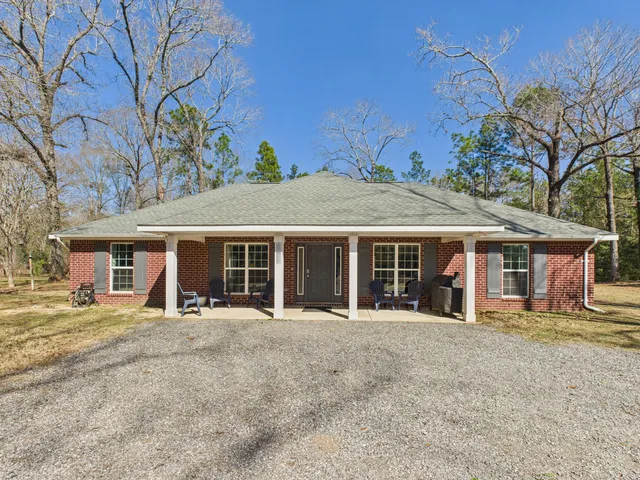 a swimming pool with outdoor seating