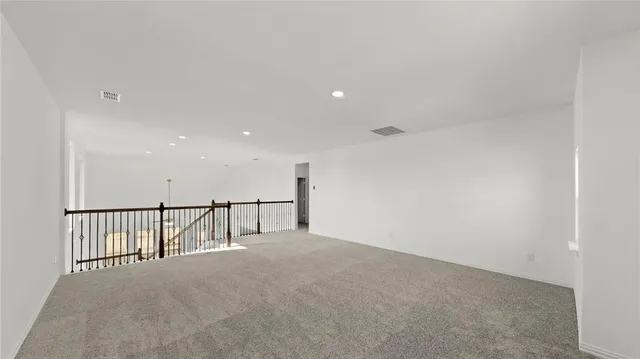 a view of staircase with white walls