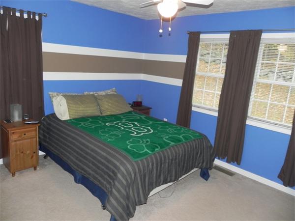 536 Cutler Road Barre, MA 01005 - Photo 12 of 24 a bed sitting in a bedroom next to a window