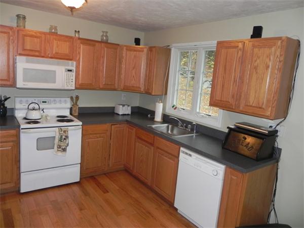 536 Cutler Road Barre, MA 01005 - Photo 4 of 24 a kitchen with a sink a stove cabinets and wooden floor