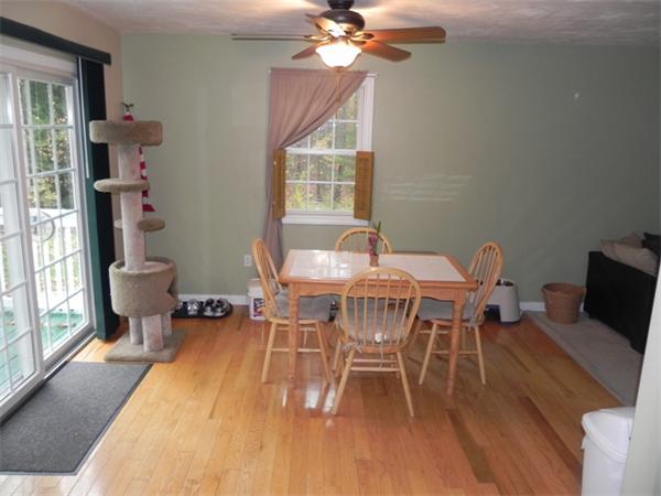 536 Cutler Road Barre, MA 01005 - Photo 5 of 24 a dining room with furniture a chandelier and wooden floor
