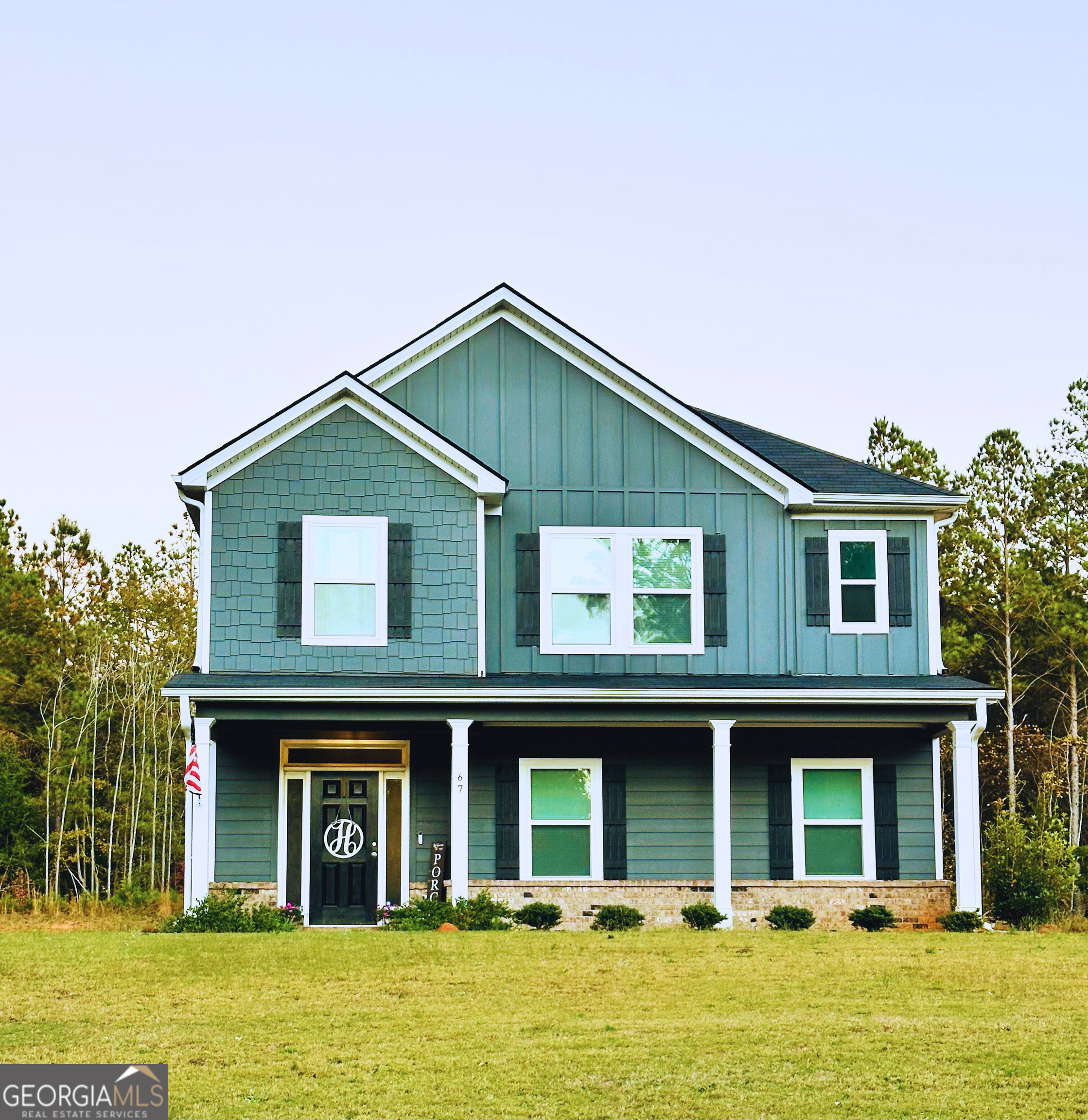 a front view of a house with a yard