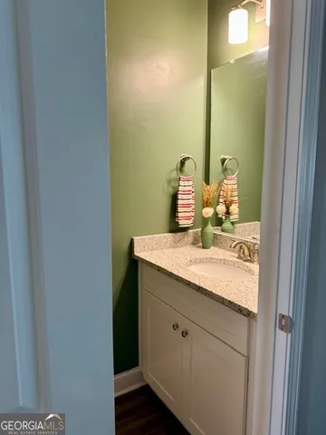 a bedroom with a bed and a ceiling fan