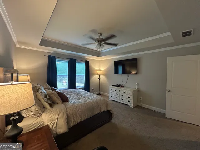 a bed room with a bed and window