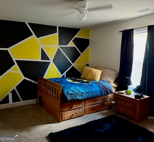 a bedroom with furniture and a window