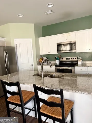 a living room with furniture window and wooden floor