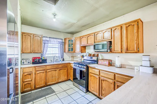 a very nice looking dining room with a large window