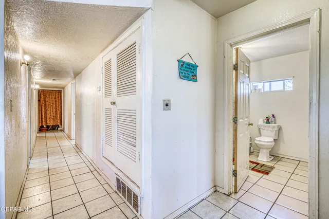 a bedroom with bed and a window