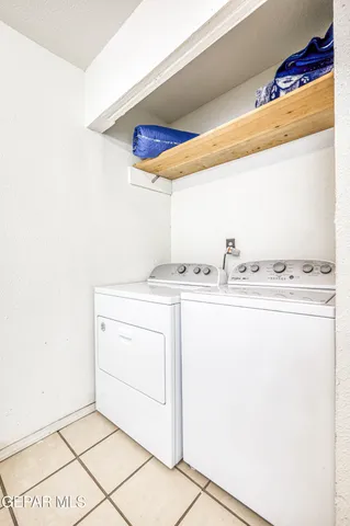a living room with furniture gym equipment and a flat screen tv