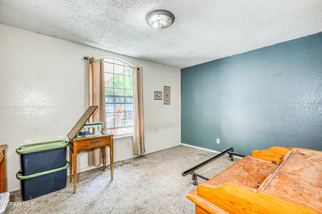 a view of a hallway with a dining area front door