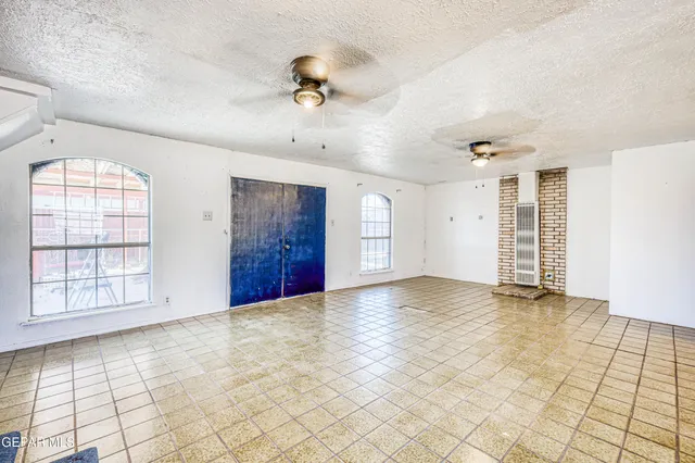 a view of a garage with wooden roof and glass door