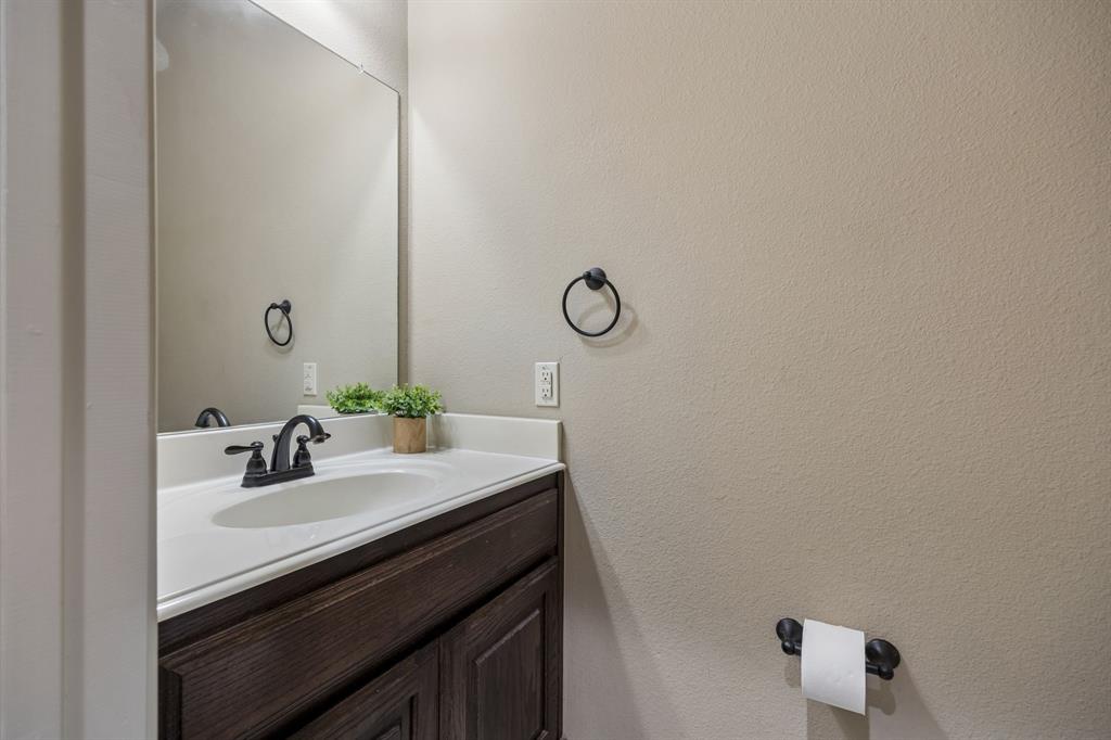 1014 Dunhill Lane Forney, TX 75126 - Photo 17 of 38 This half bath is conviently located for guest and is located across the laundry room.