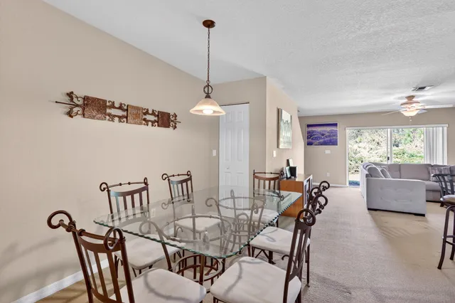 a dining room with furniture and window