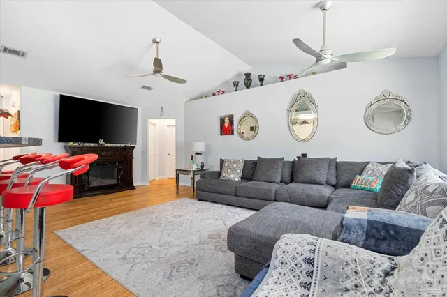 a living room with furniture and a flat screen tv