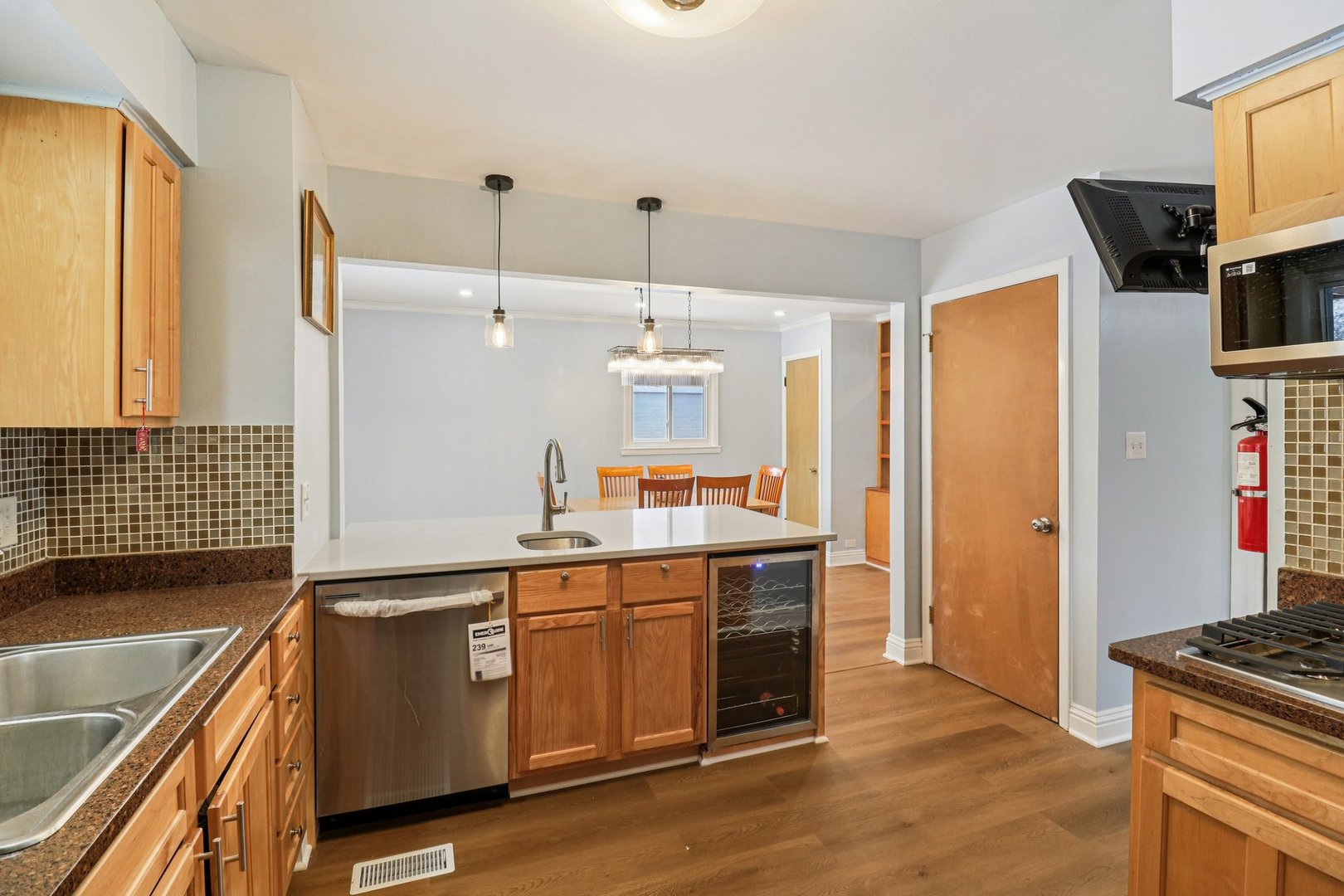 2931 Greenleaf Avenue Wilmette, IL 60091 - Photo 15 of 44 a kitchen with a sink stove and refrigerator
