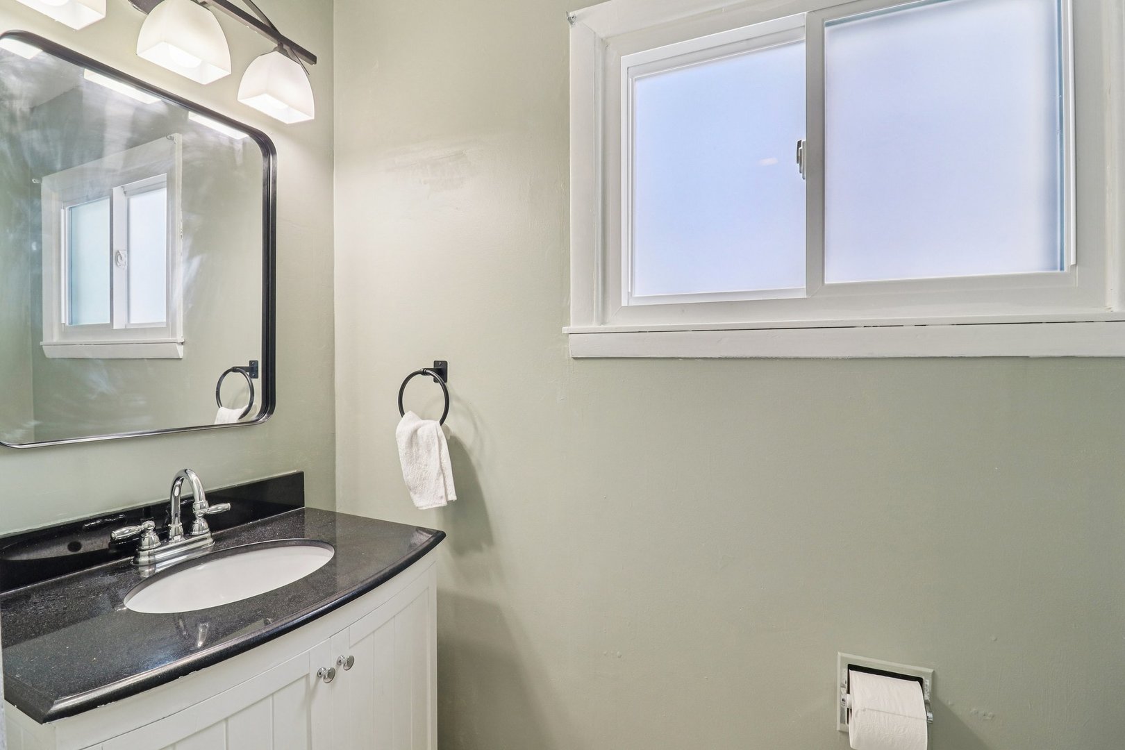 2931 Greenleaf Avenue Wilmette, IL 60091 - Photo 30 of 44 a bathroom with a granite countertop sink and a mirror