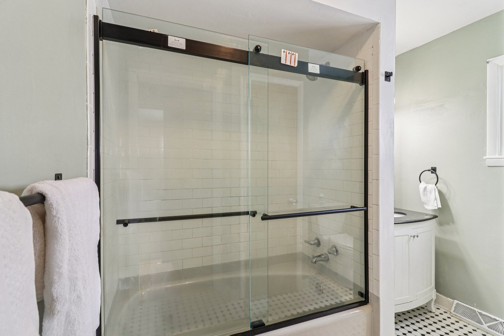 2931 Greenleaf Avenue Wilmette, IL 60091 - Photo 31 of 44 a bathroom with a glass shower door