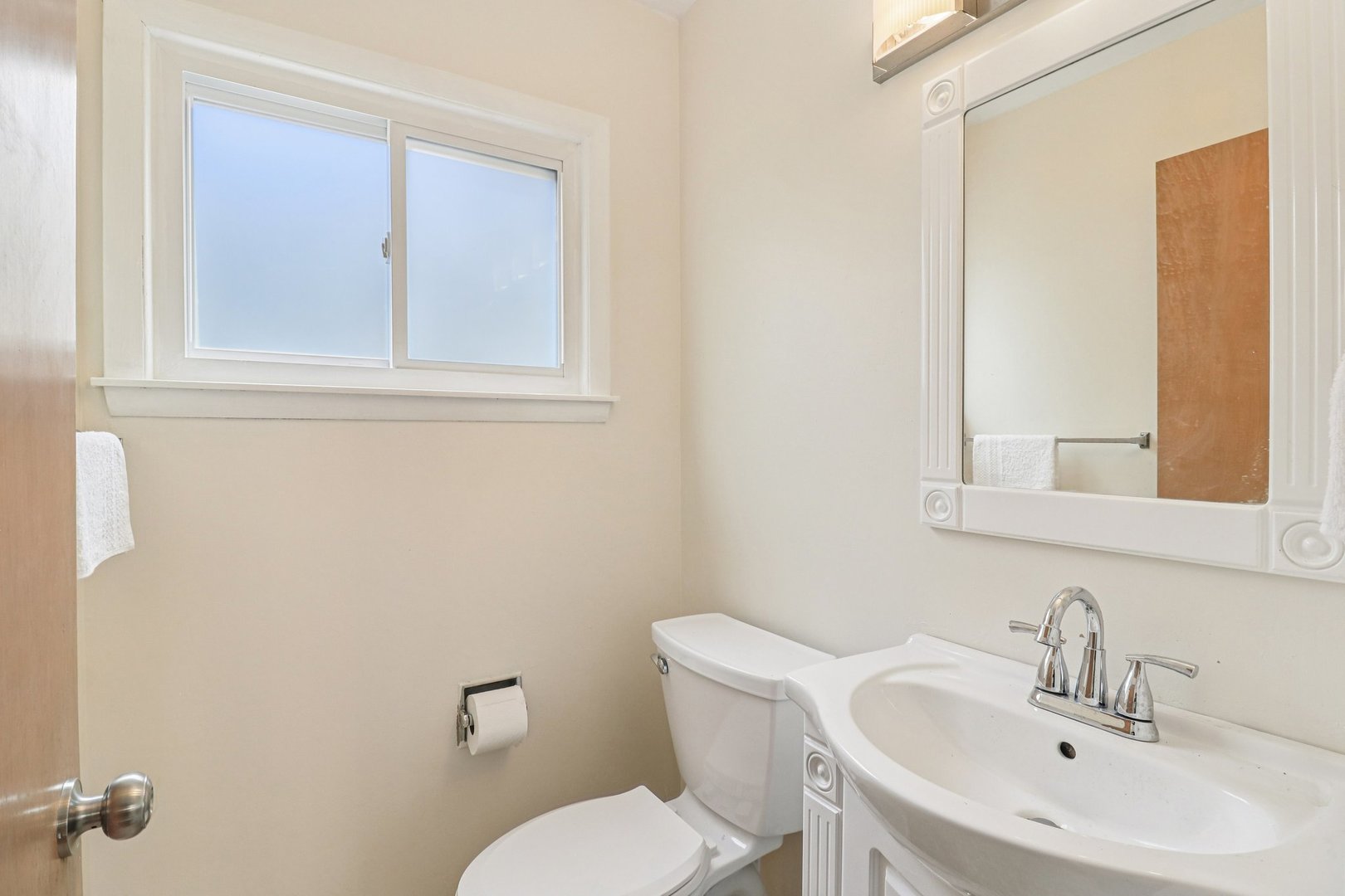 2931 Greenleaf Avenue Wilmette, IL 60091 - Photo 32 of 44 a bathroom with a toilet a sink and mirror
