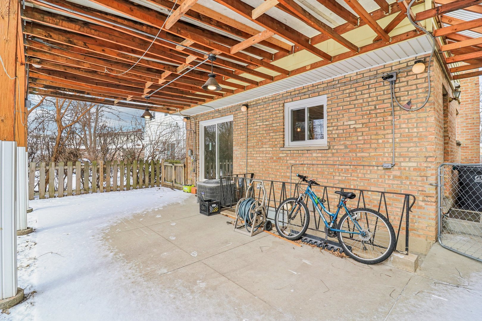 2931 Greenleaf Avenue Wilmette, IL 60091 - Photo 38 of 44 a view of porch with furniture and a garage