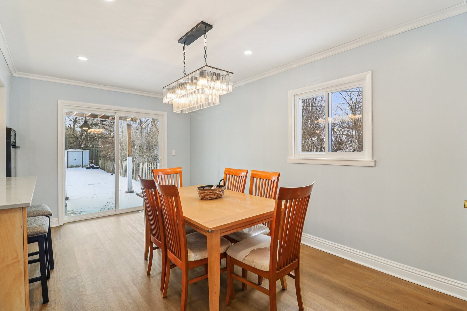 2931 Greenleaf Avenue Wilmette, IL 60091 - Photo 8 of 44 a view of a dining room with furniture wooden floor and chandelier