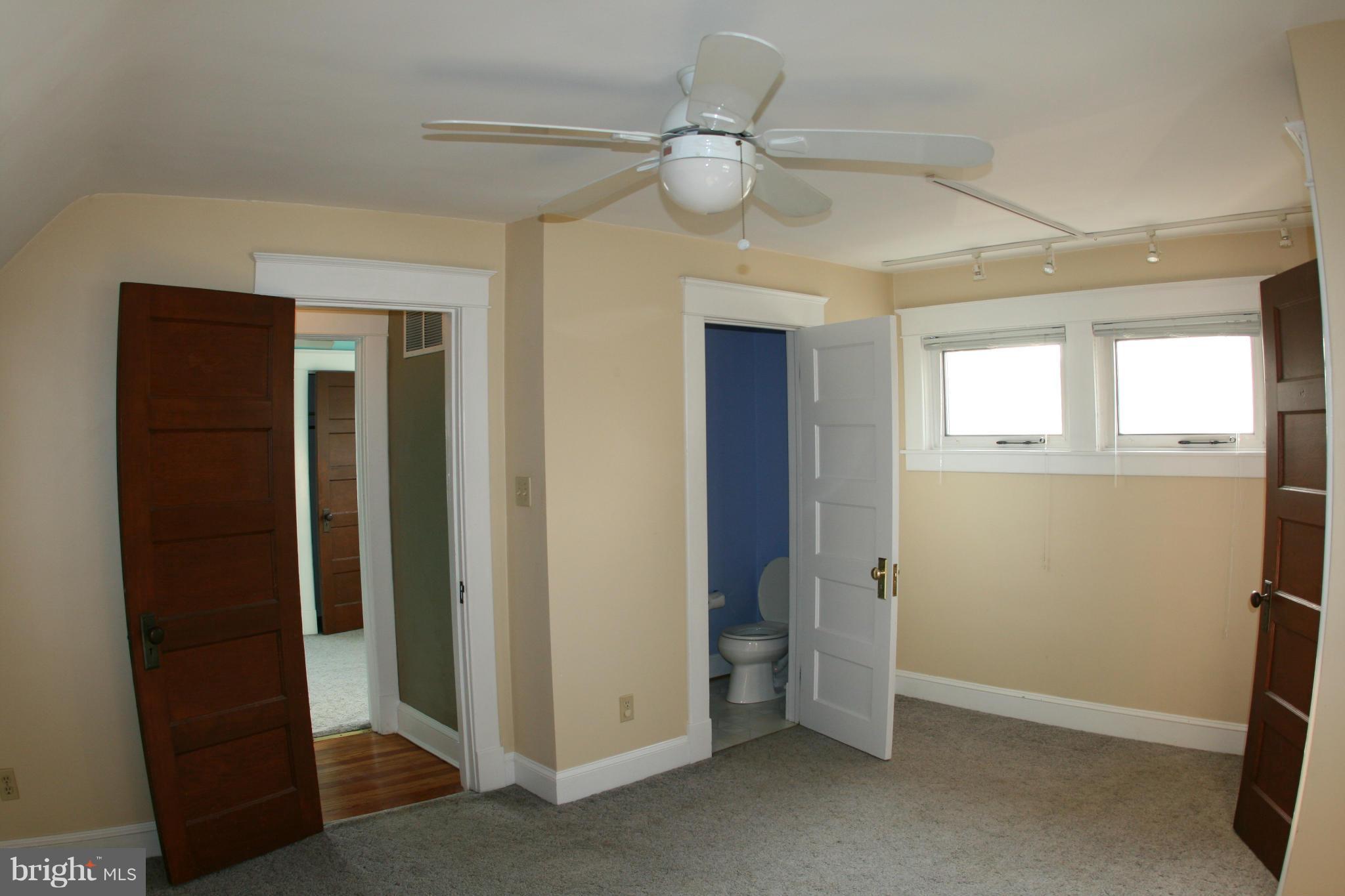 23 Edmondson Ridge Road Catonsville, MD 21228 - Photo 12 of 18 an empty room with windows and fan