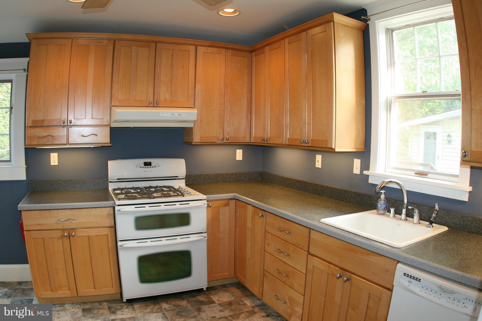 23 Edmondson Ridge Road Catonsville, MD 21228 - Photo 4 of 18 a kitchen with a sink stove and cabinets